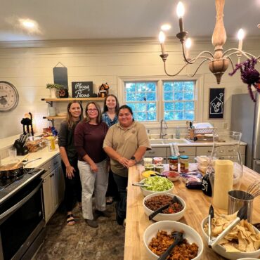members preparing dinner for Ronald McDonald House